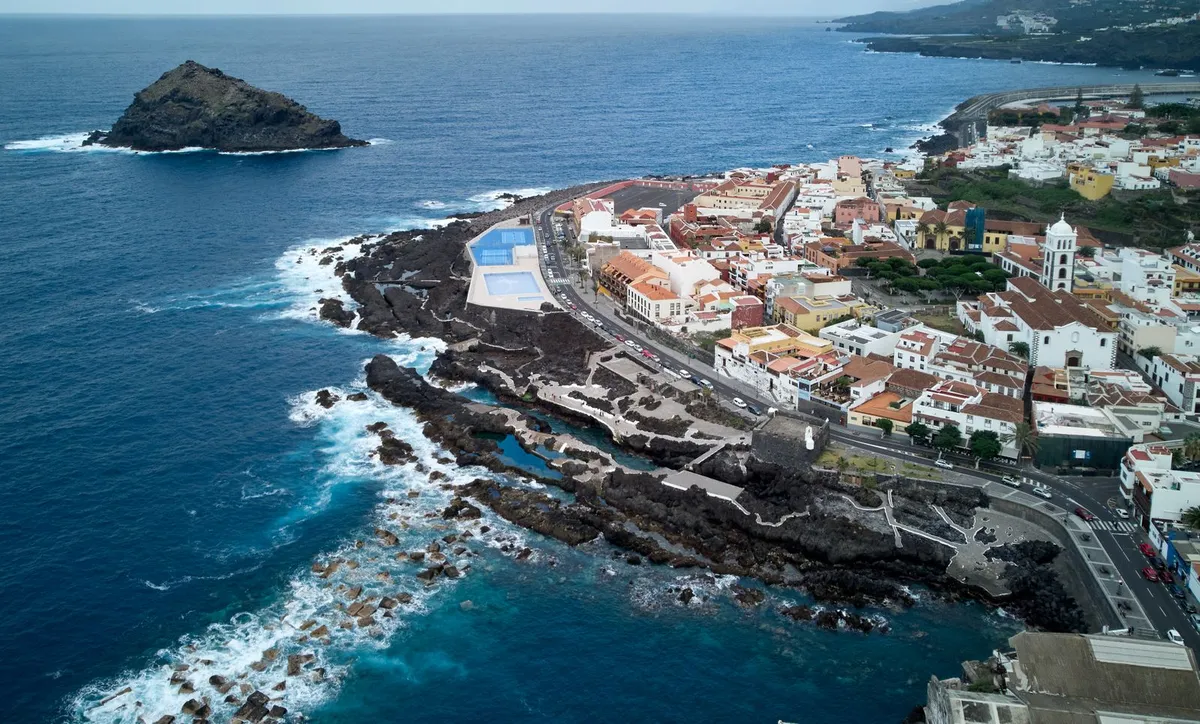 Aerial view of Garachico, its offshore rock and natural lava rock pools on the north coast of Tenerife