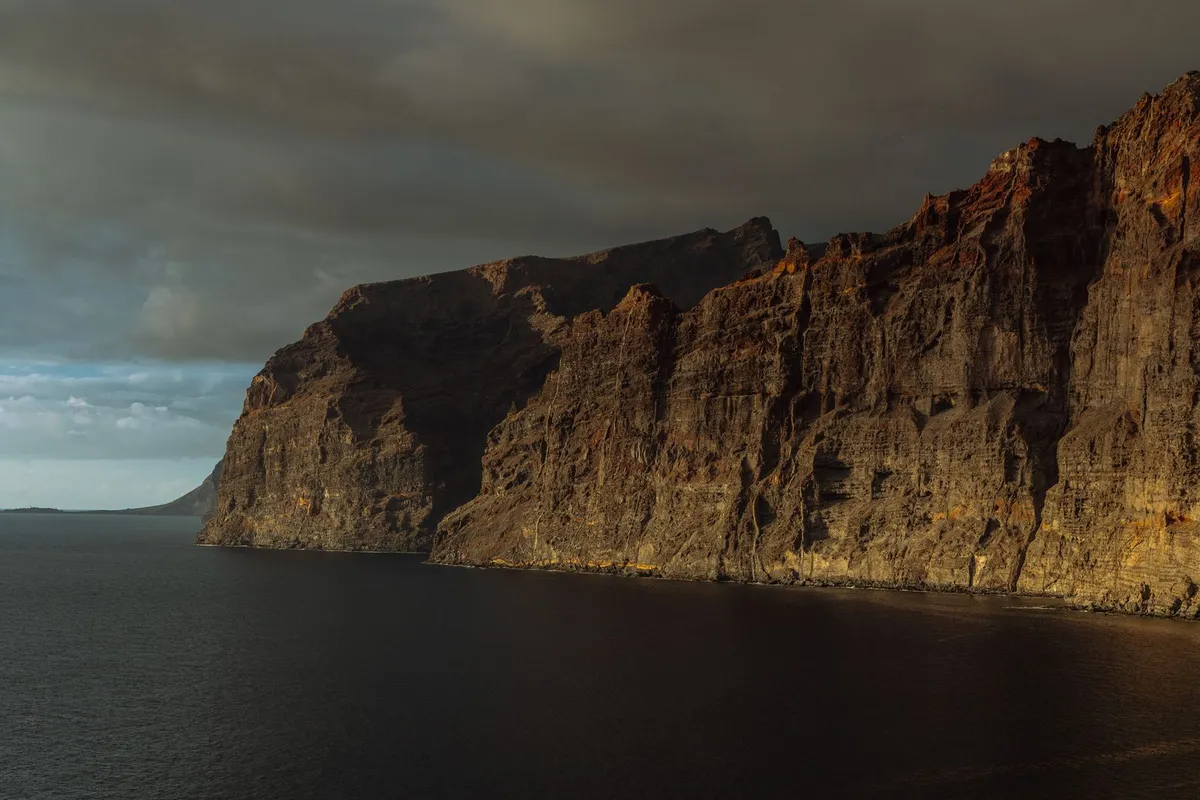 The sheer cliffs of Los Gigantes rising from the Atlantic at sunset, west Tenerife