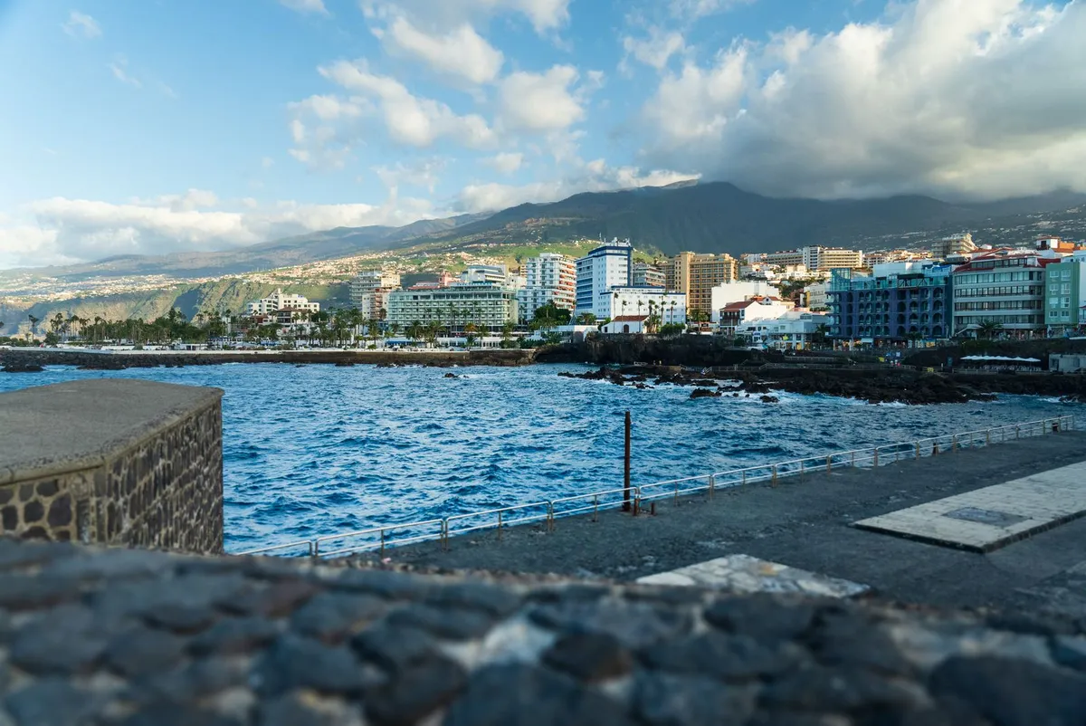 The seafront promenade and coastline of Puerto de la Cruz, with mountains behind, north Tenerife