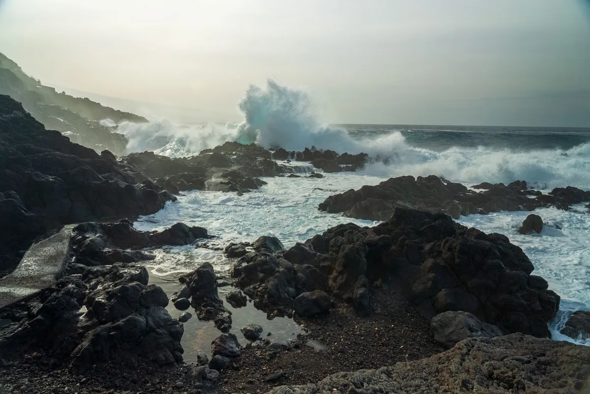 Atlantic surf breaking over black volcanic rock, Tenerife